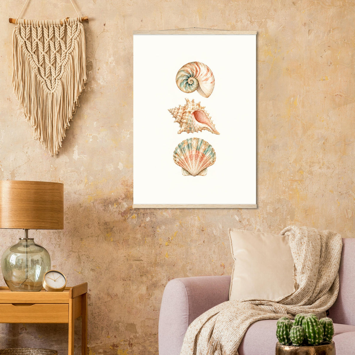 Coastal wall art featuring three seashells displayed in a bright living room.