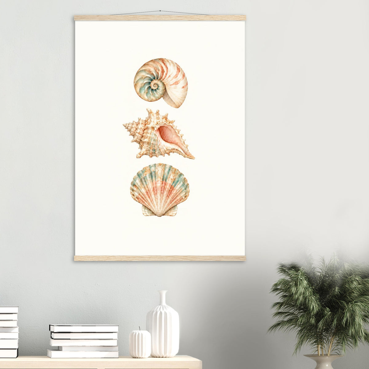 Coastal seashell wall art with wooden poster rails displayed above a modern cabinet.