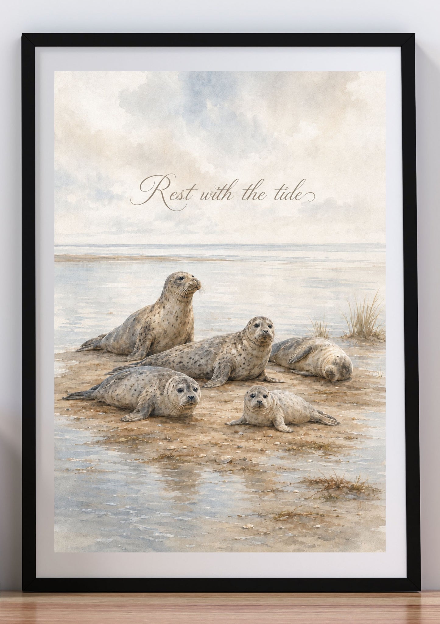 Maritime harbor seal wall art in a natural wood frame with neutral coastal home decor