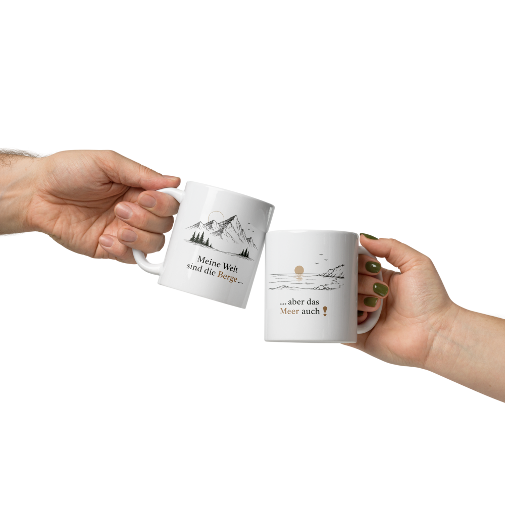 White coffee mug with mountain artwork passed between two hands against a light background
